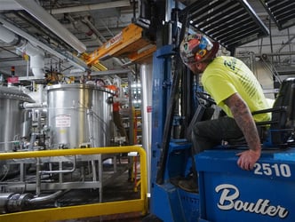 Installing a beverage processing tank in a tight space.