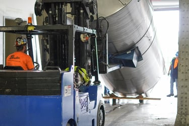 Rigging a large stainless steel beverage tank into Black Button Distilling