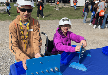 Students attempting a nut and bolt exercise at GLOW With Your Hands