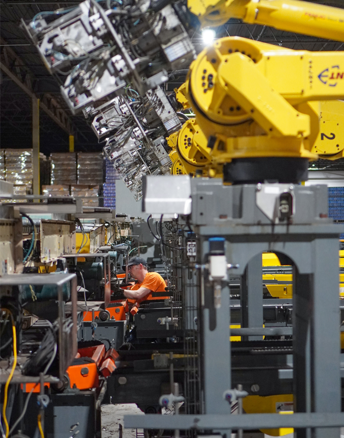 Millwright performing maintenance work on conveyor belt.