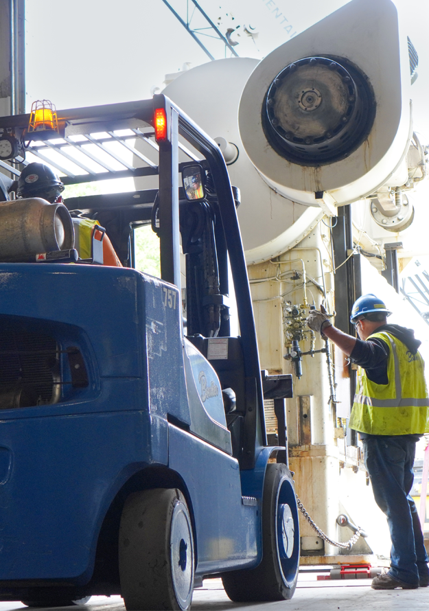 Rigging heavy machinery out of McAlpin's facility.