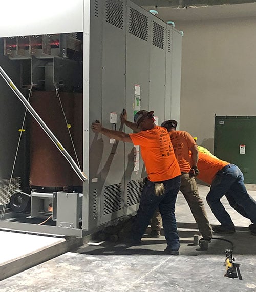 workers setting up unit