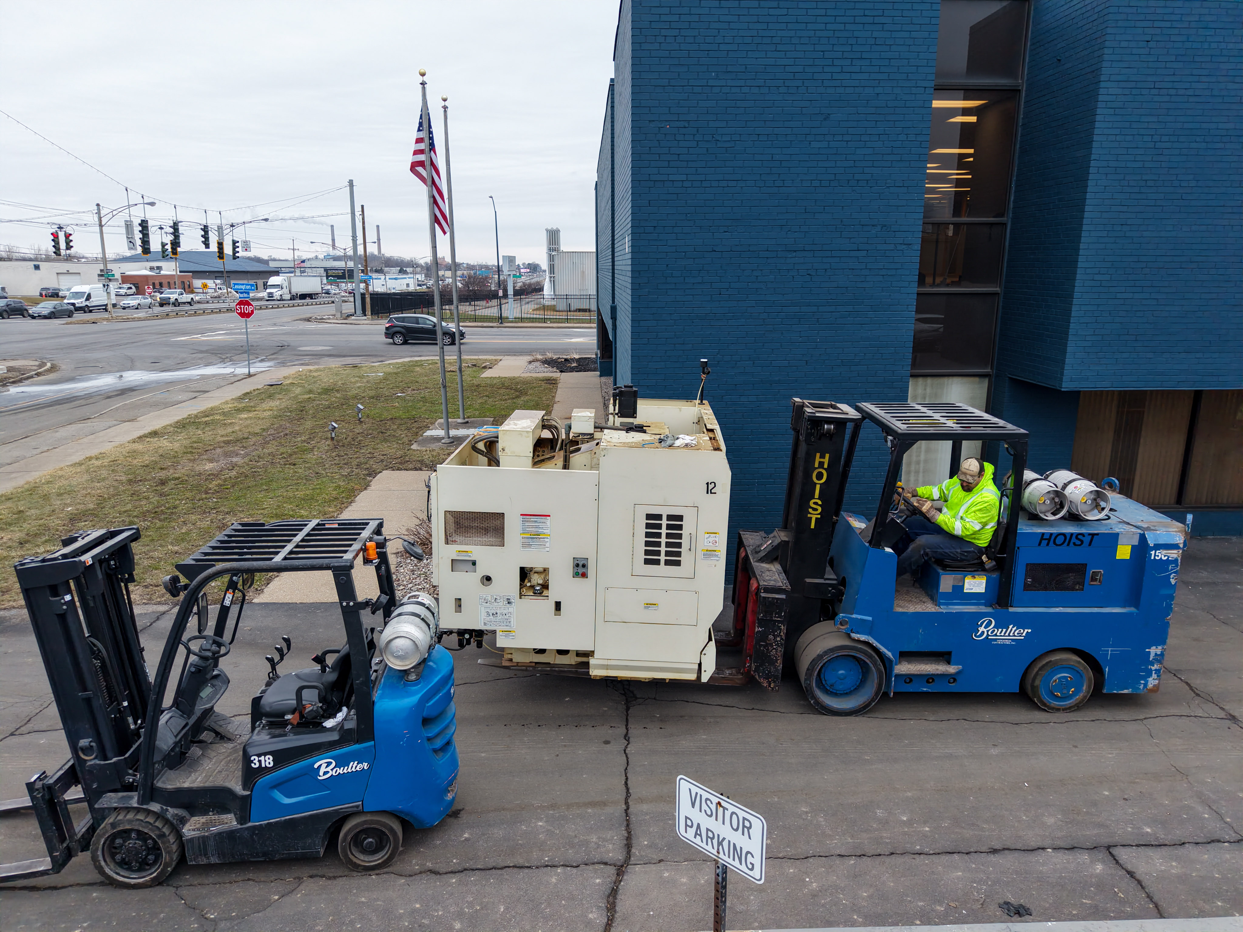 Fork Truck Backing a CNC Machine into a Facility