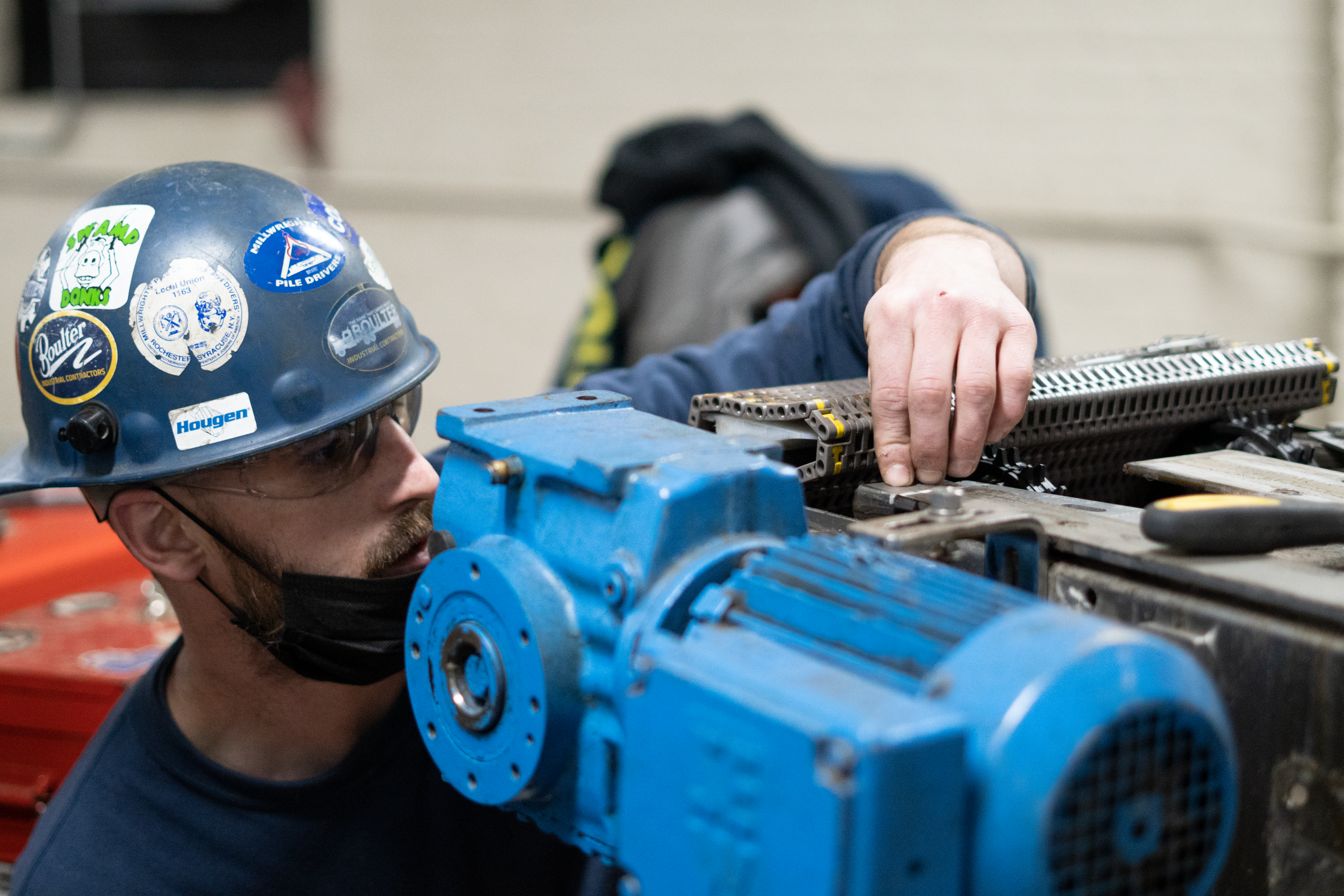 Millwright adding conveyor to existing canning line