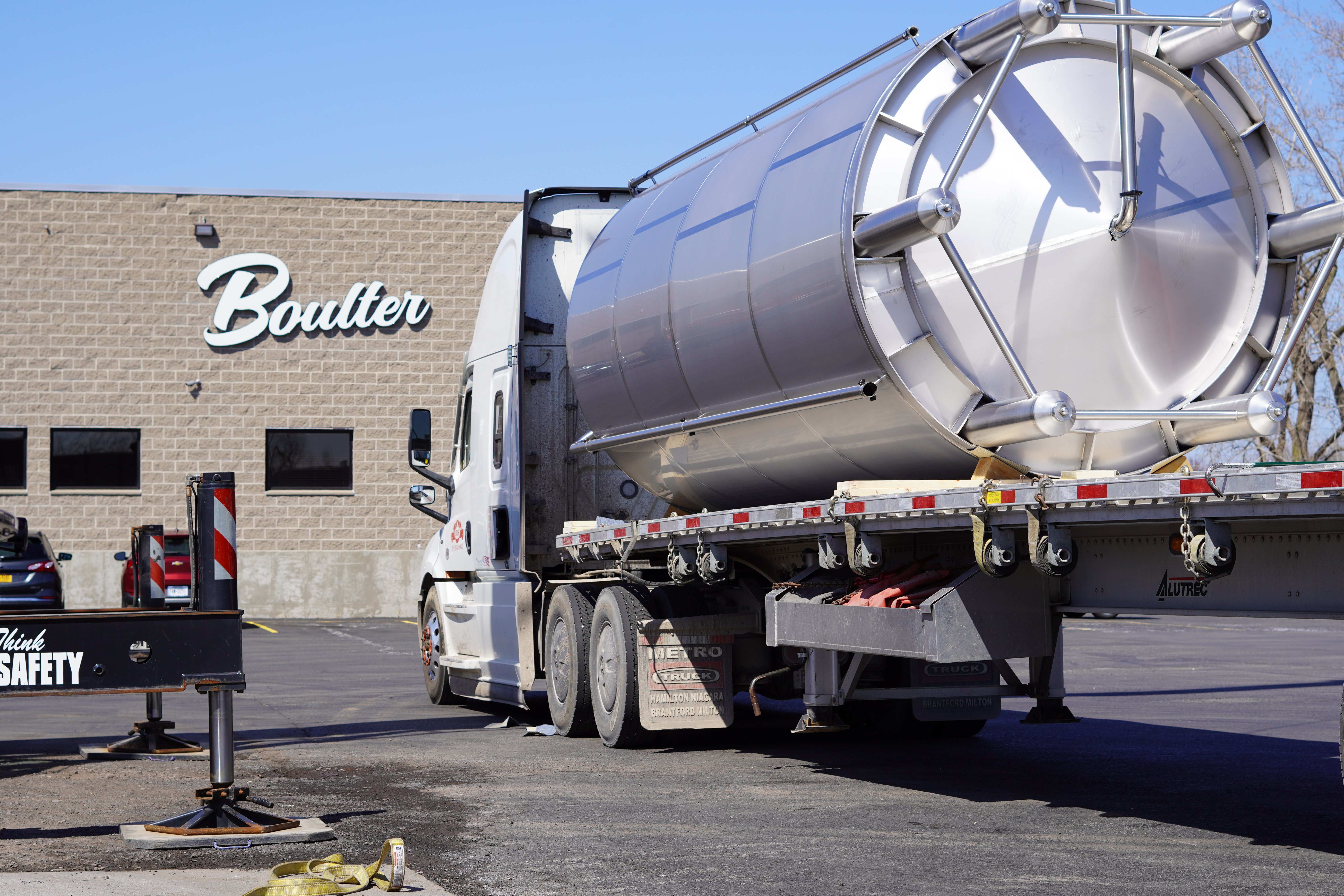 One of fourteen tanks being offloaded in Boulter's yard