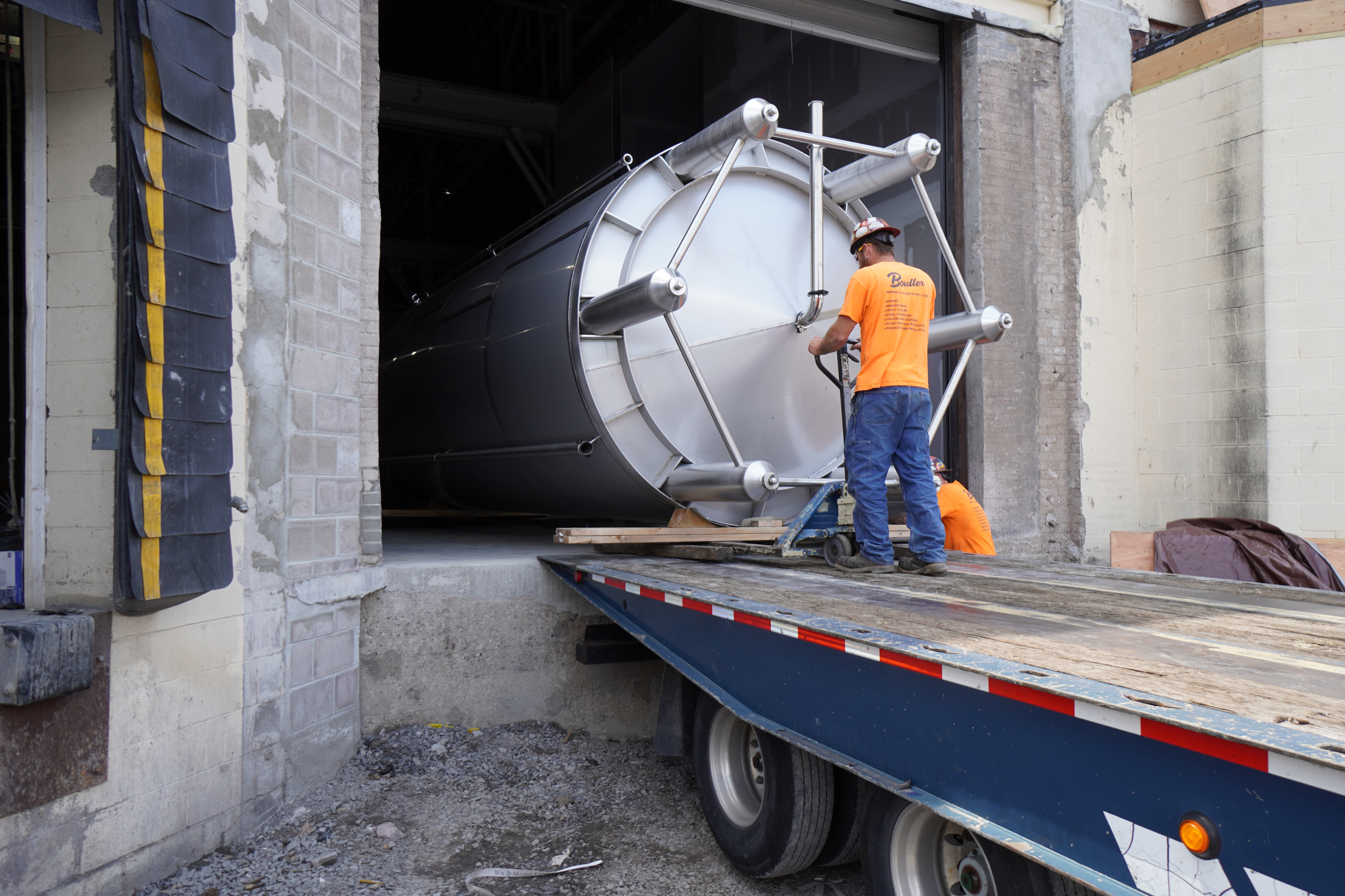 Millwright guiding tank into Black Button