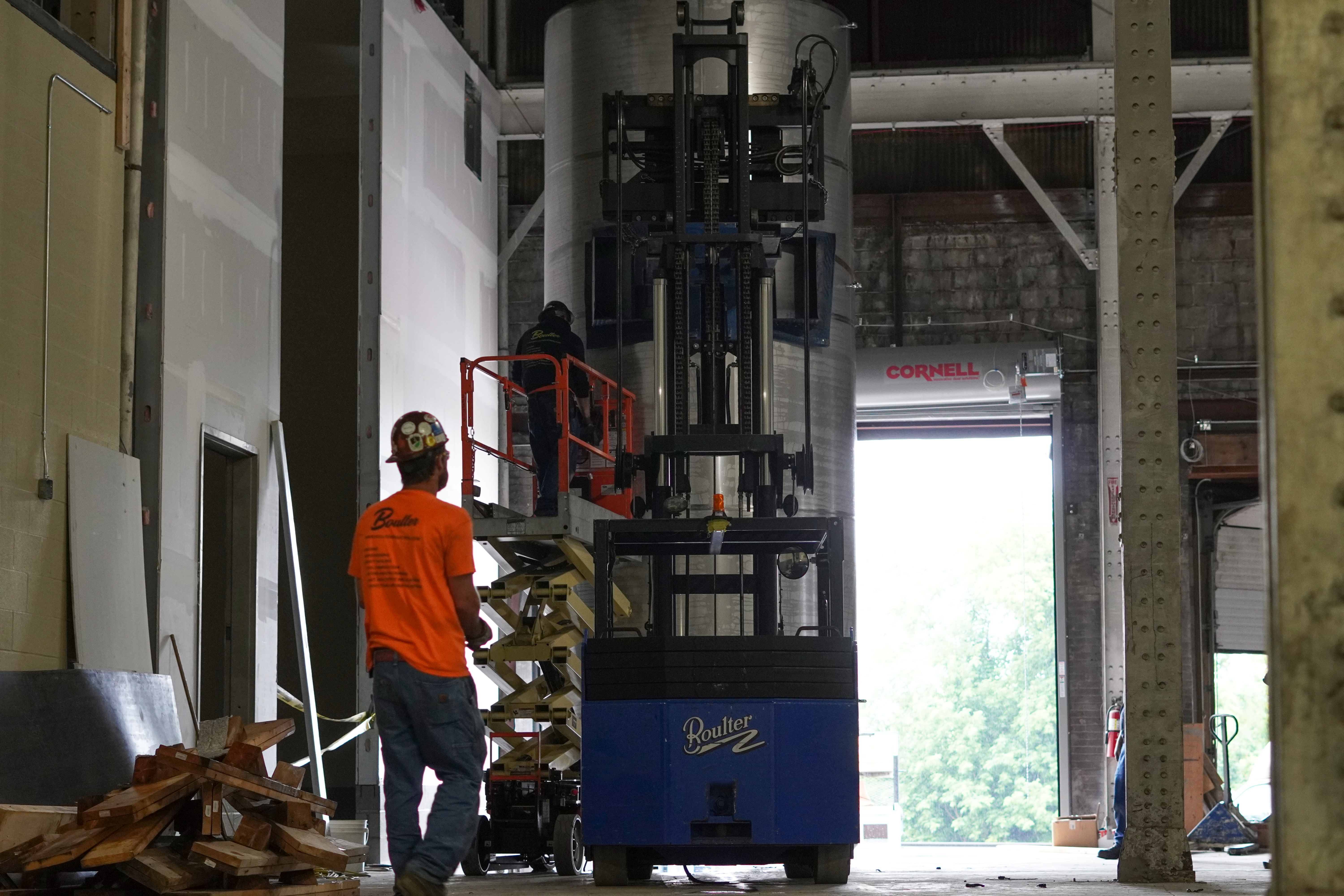 Standing one large tank up into Black Button's new facility