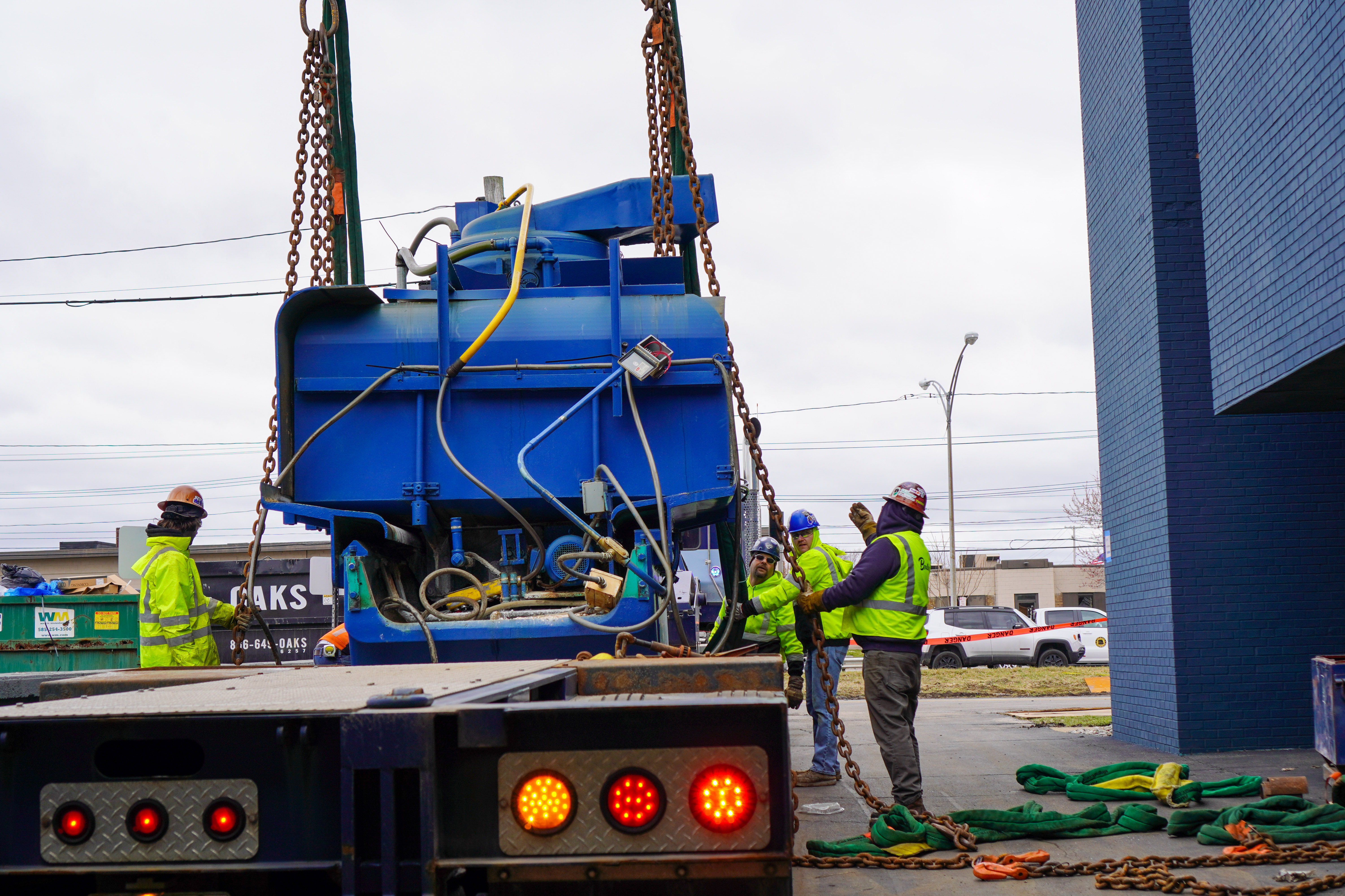 Optical Grinder Being Offloaded by Crane
