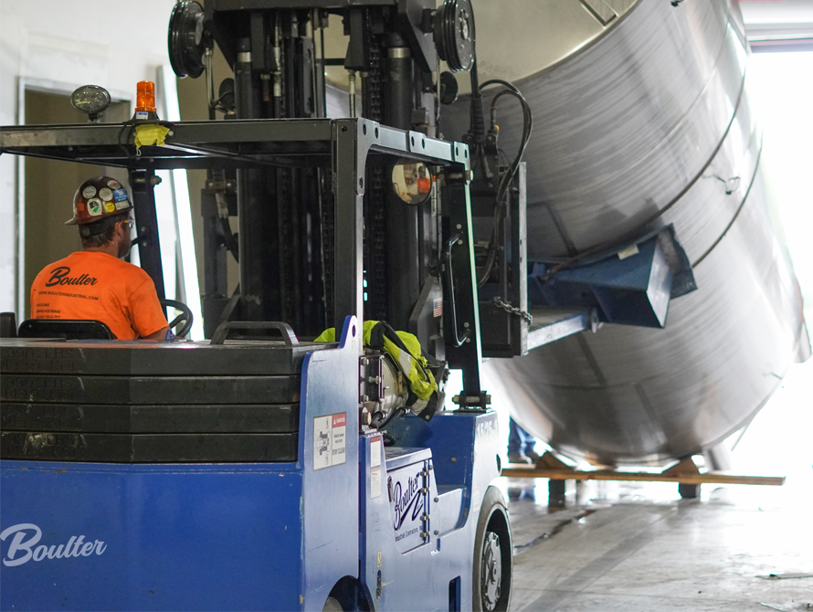 Lifting a stainless steel beverage tank to move into location