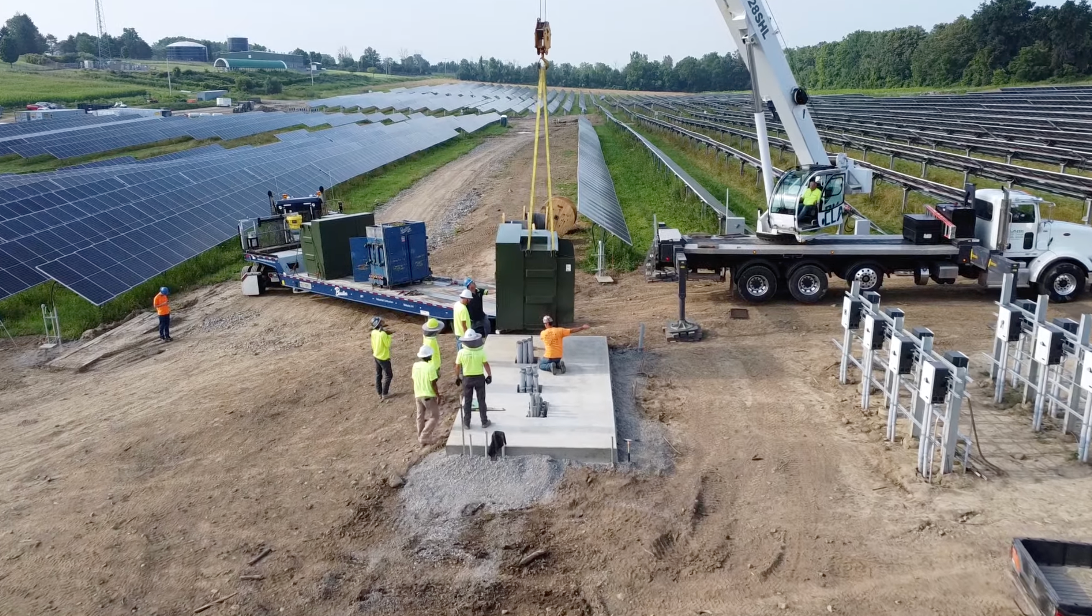 Wide angle shot of crane and flatbed truck for transformer installation